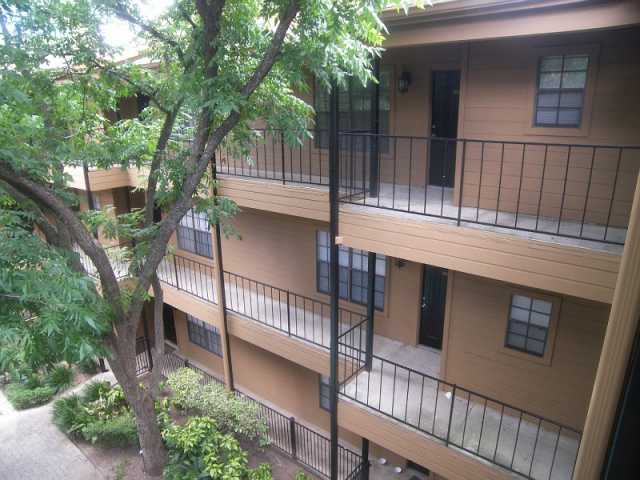 203 East 31st Street, Unit 310 Austin, TX 78705 - Photo 3 of 12 a view of a house with a tree beside it