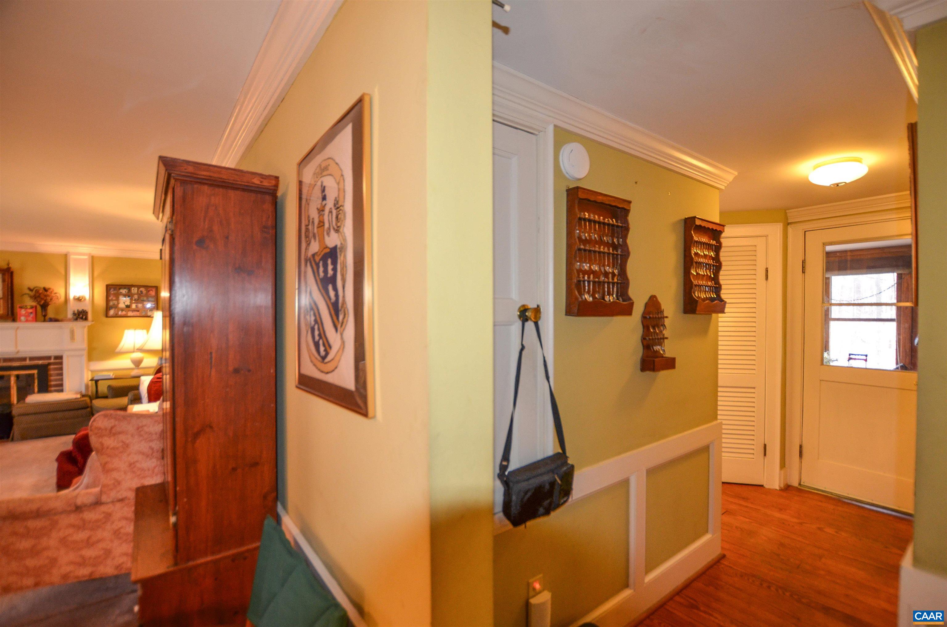 332 Point Of Fork Road Fork Union, VA 23055 - Photo 19 of 75 a view of a hallway with wooden floor and glass door