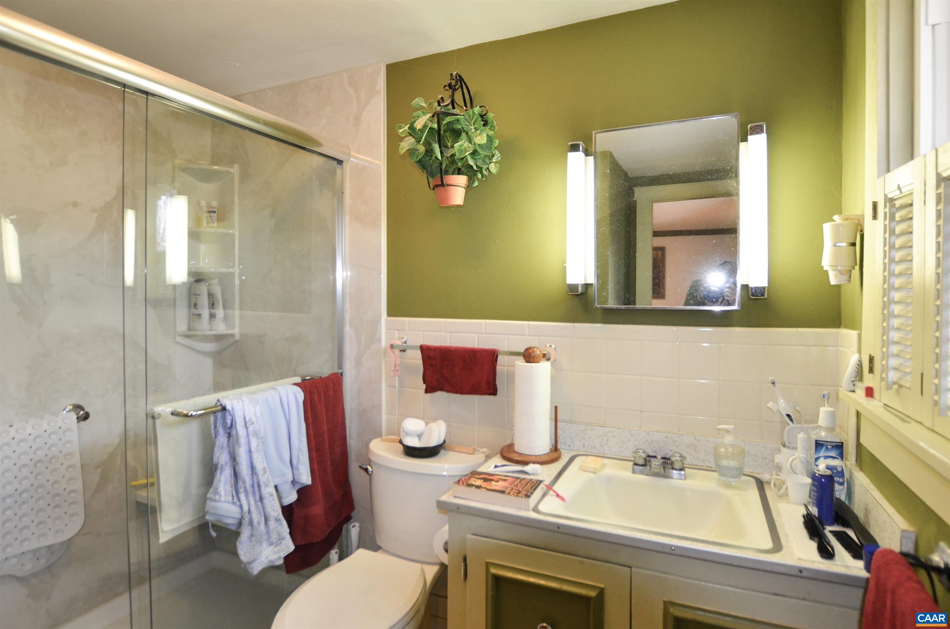 332 Point Of Fork Road Fork Union, VA 23055 - Photo 27 of 75 a bathroom with a sink mirror vanity and toilet