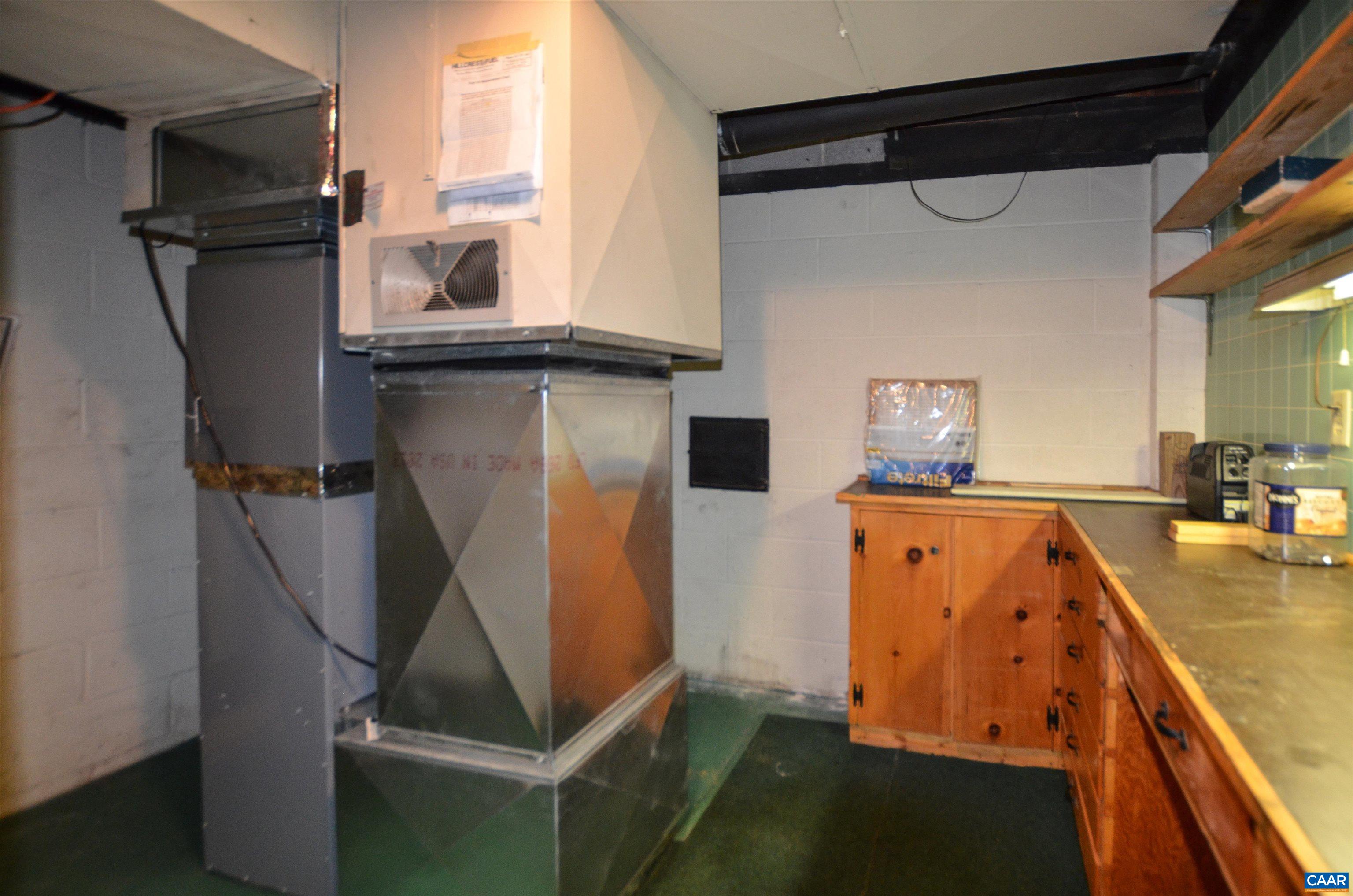332 Point Of Fork Road Fork Union, VA 23055 - Photo 50 of 75 a view of a kitchen with fridge and wooden floor