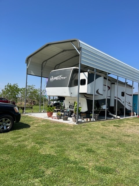 1179 Diamond Road Crystal Beach, TX 77650 - Photo 4 of 5 a view of a chairs and table in the backyard