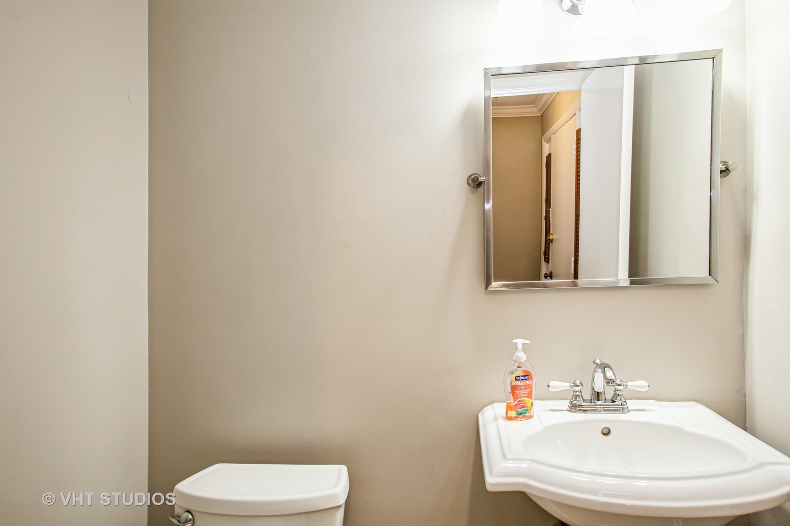 1660 Darwin Court Wheaton, IL 60189 - Photo 3 of 17 a bathroom with a sink a toilet and mirror