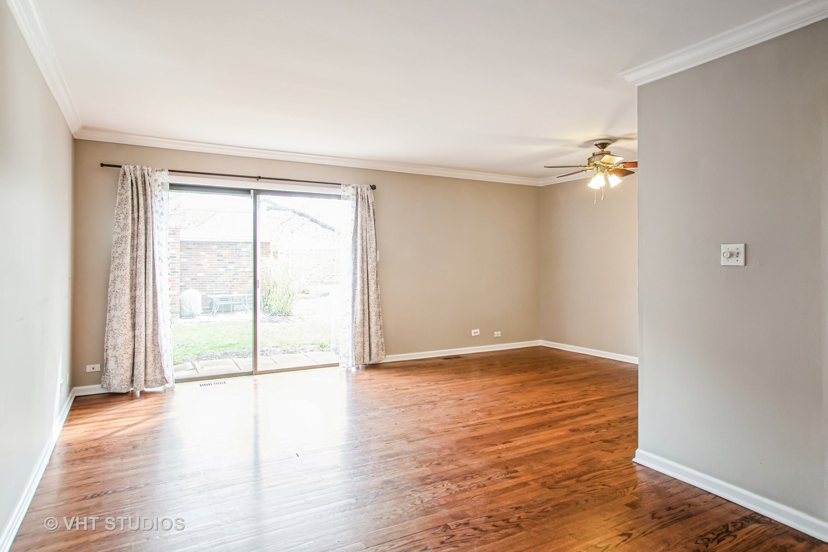 1660 Darwin Court Wheaton, IL 60189 - Photo 4 of 17 an empty room with wooden floor and windows