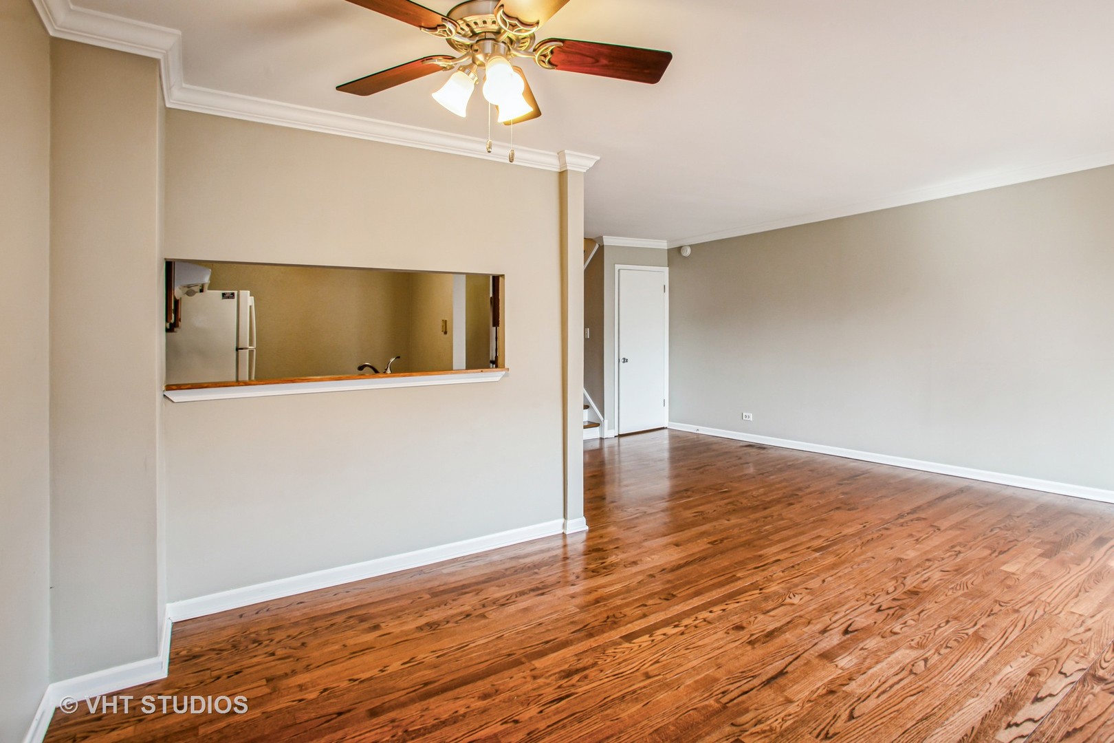 1660 Darwin Court Wheaton, IL 60189 - Photo 7 of 17 an empty room with wooden floor fan and windows