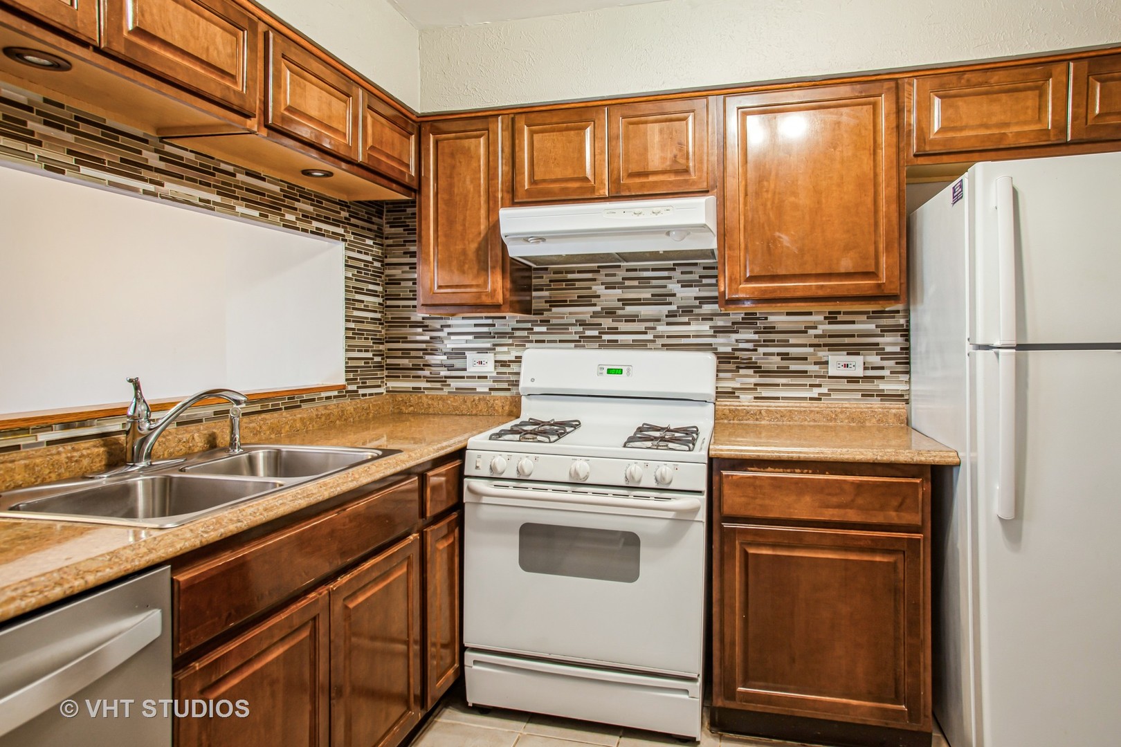 1660 Darwin Court Wheaton, IL 60189 - Photo 9 of 17 a kitchen with a stove sink and refrigerator