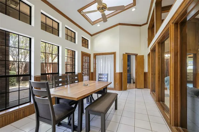 a view of a patio with dining table and chairs