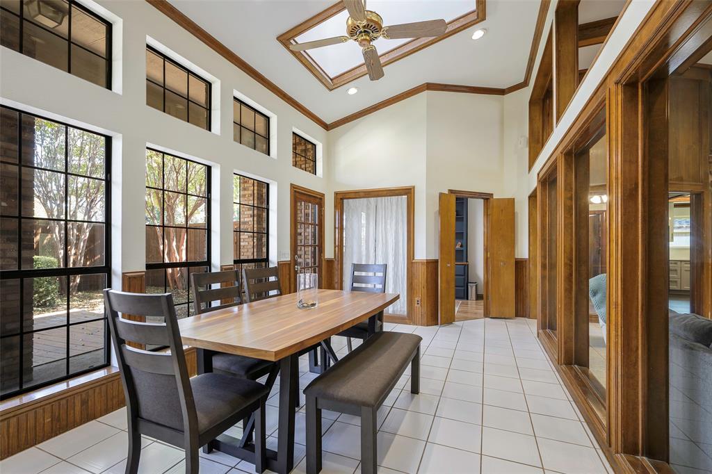 925 Spring Brook Drive Allen, TX 75002 - Photo 16 of 26 a view of a patio with dining table and chairs