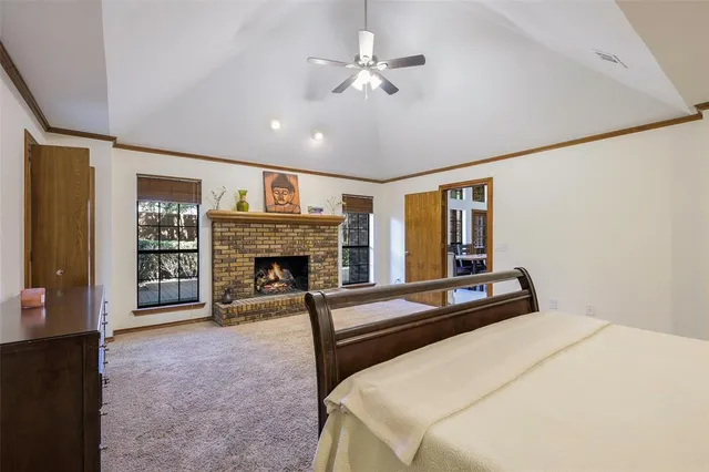 a bedroom with a bed and a fireplace