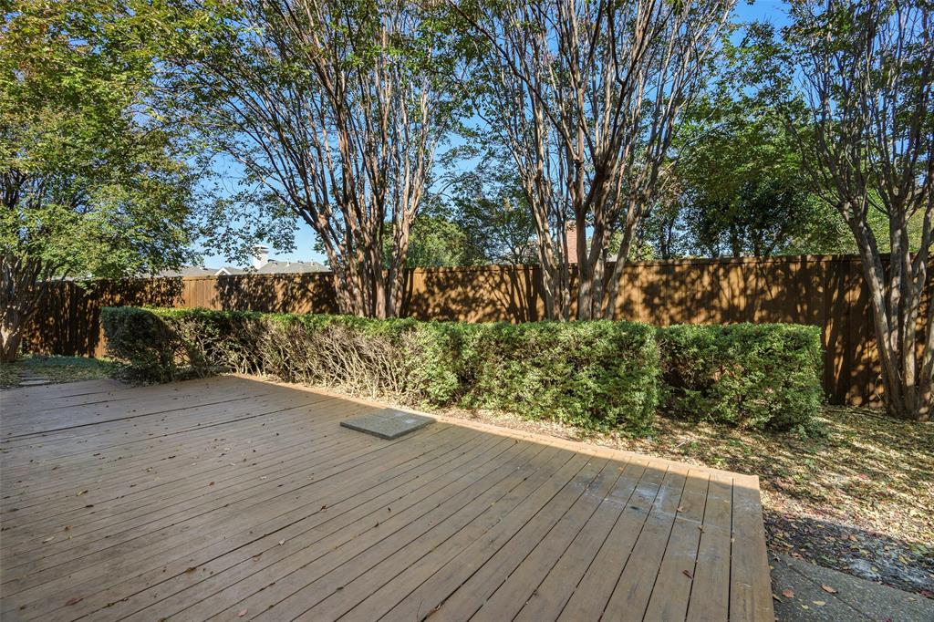 925 Spring Brook Drive Allen, TX 75002 - Photo 25 of 26 a wooden bench with view of trees in the background