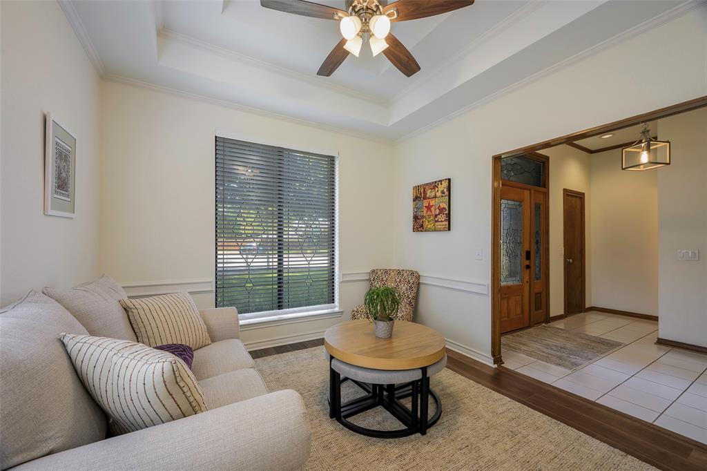925 Spring Brook Drive Allen, TX 75002 - Photo 3 of 26 a living room with furniture and a large window