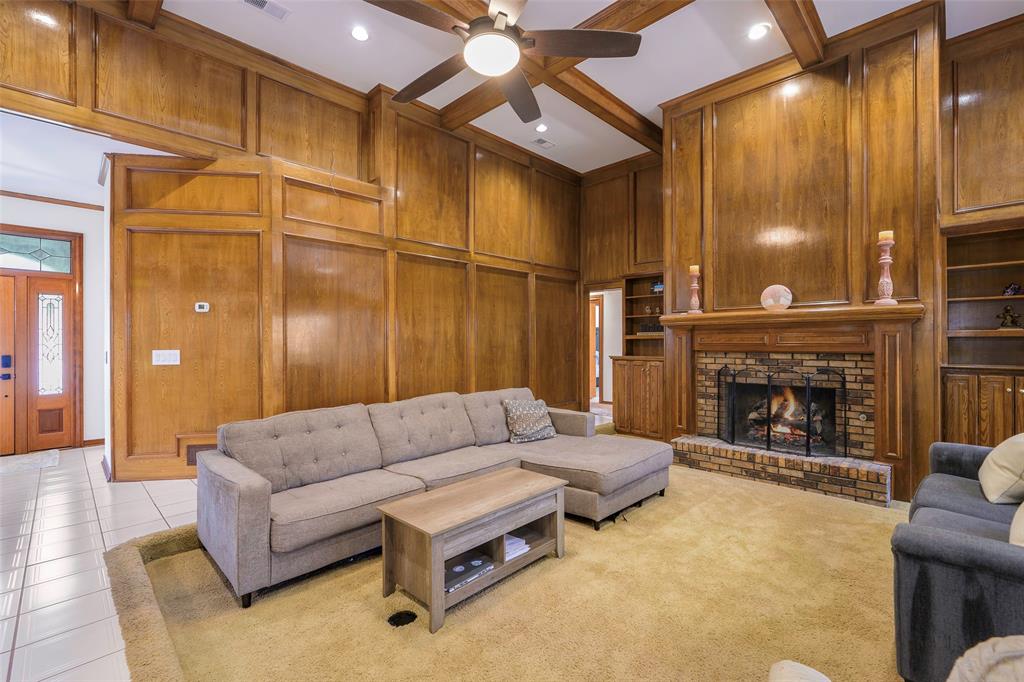 925 Spring Brook Drive Allen, TX 75002 - Photo 6 of 26 a living room with furniture and a fireplace