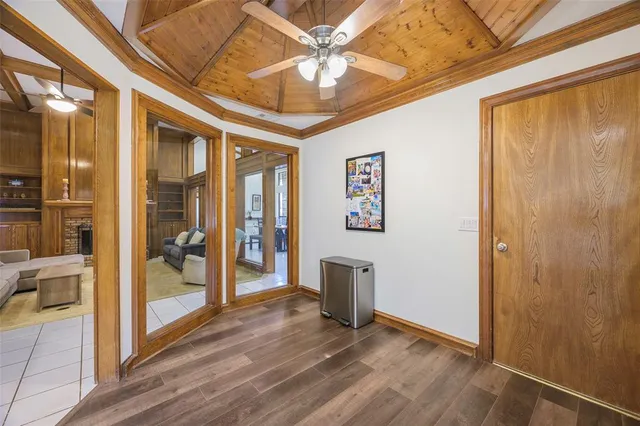 a view of an entryway with wooden floor