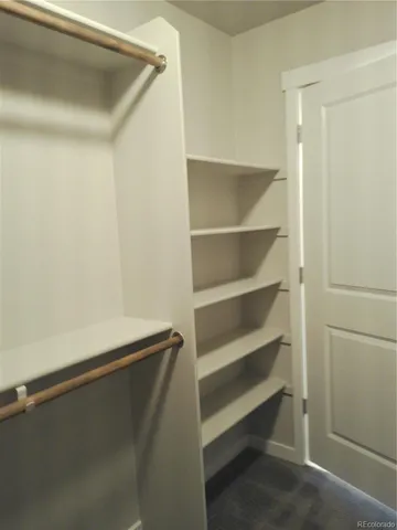 a view of an empty walk in closet