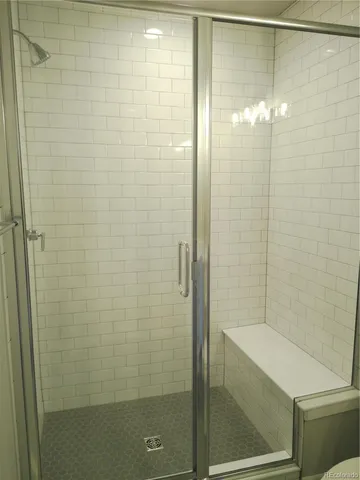 a view of a brick house with many windows