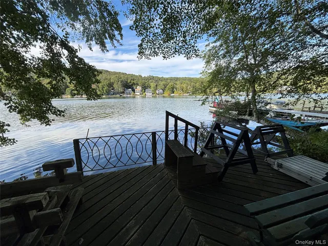 a view of a chairs and table on the wooden floor