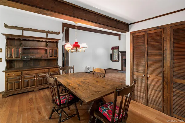 a dining room with furniture and wooden floor
