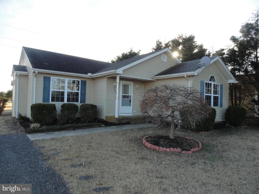 36245 Richland Road Willards, MD 21874 - Photo 1 of 14 a view of a house with backyard and porch