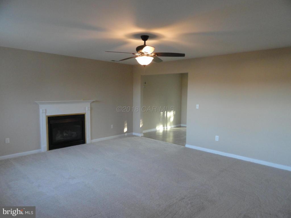 36245 Richland Road Willards, MD 21874 - Photo 2 of 14 a view of an empty room with a fireplace