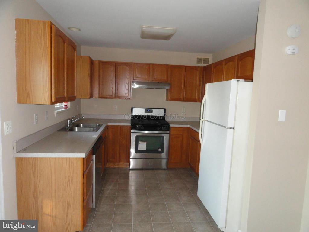 36245 Richland Road Willards, MD 21874 - Photo 4 of 14 a kitchen with a refrigerator and a stove