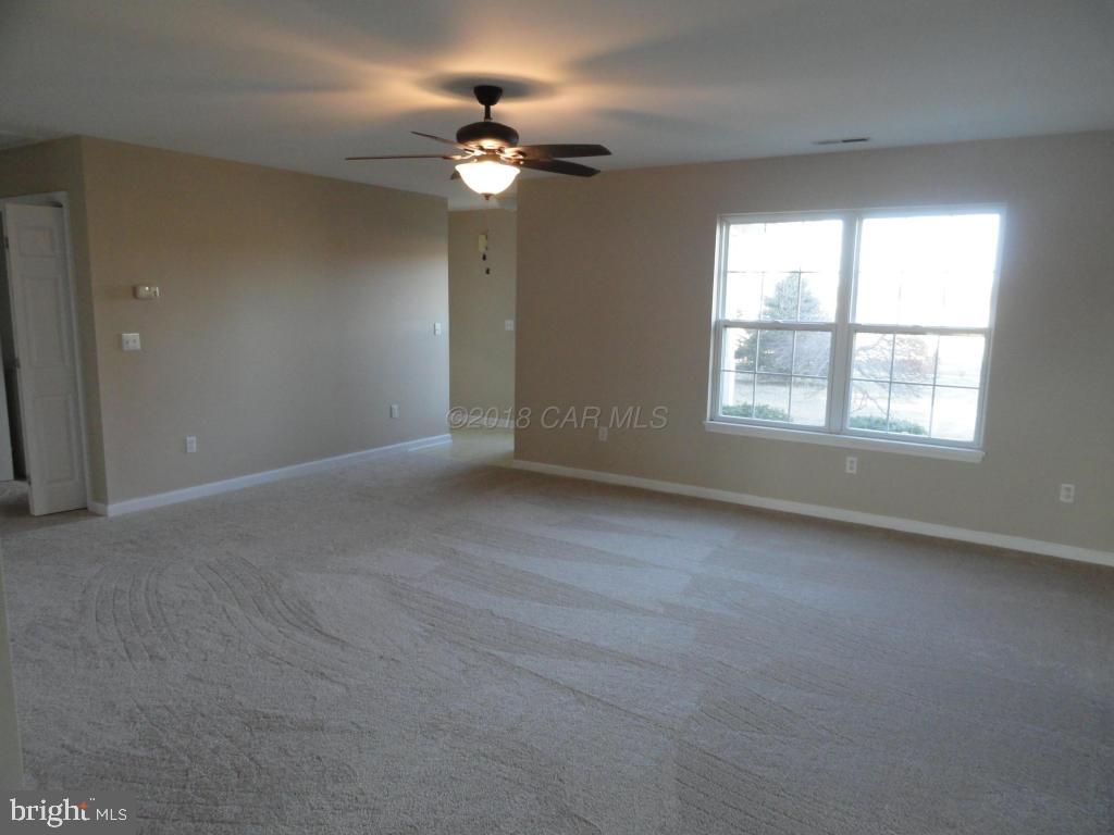 36245 Richland Road Willards, MD 21874 - Photo 5 of 14 an empty room with chandelier fan