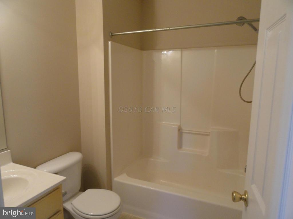 36245 Richland Road Willards, MD 21874 - Photo 8 of 14 a white toilet sitting next to a bath tub