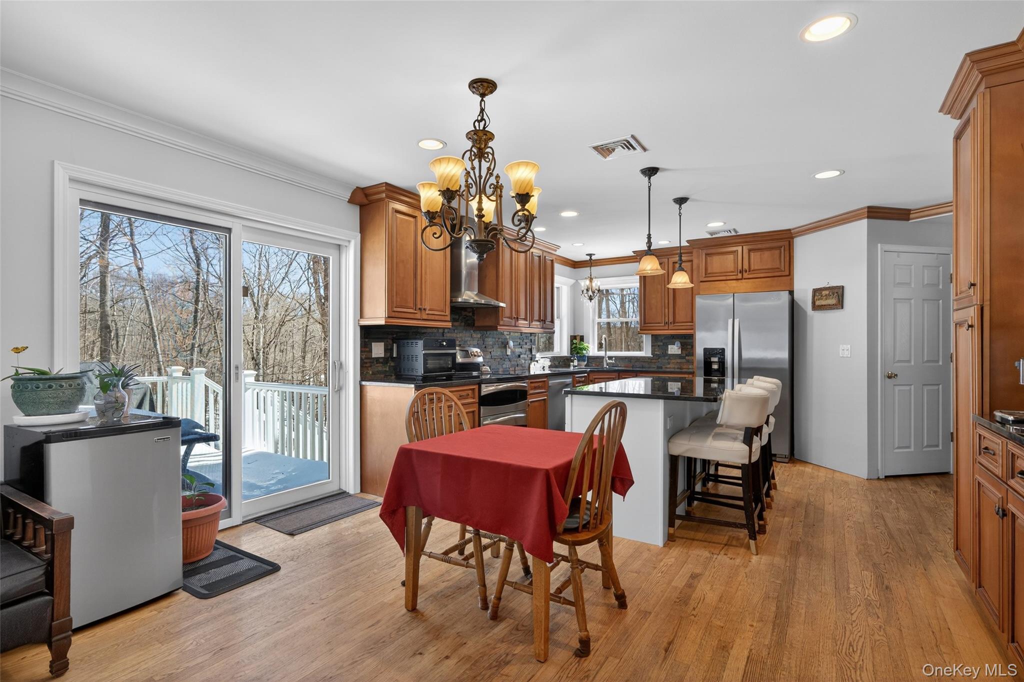 34 Booth Road Chester, NY 10918 - Photo 12 of 42 Kitchen featuring ornamental molding, wood finished floors, and suspended lighting