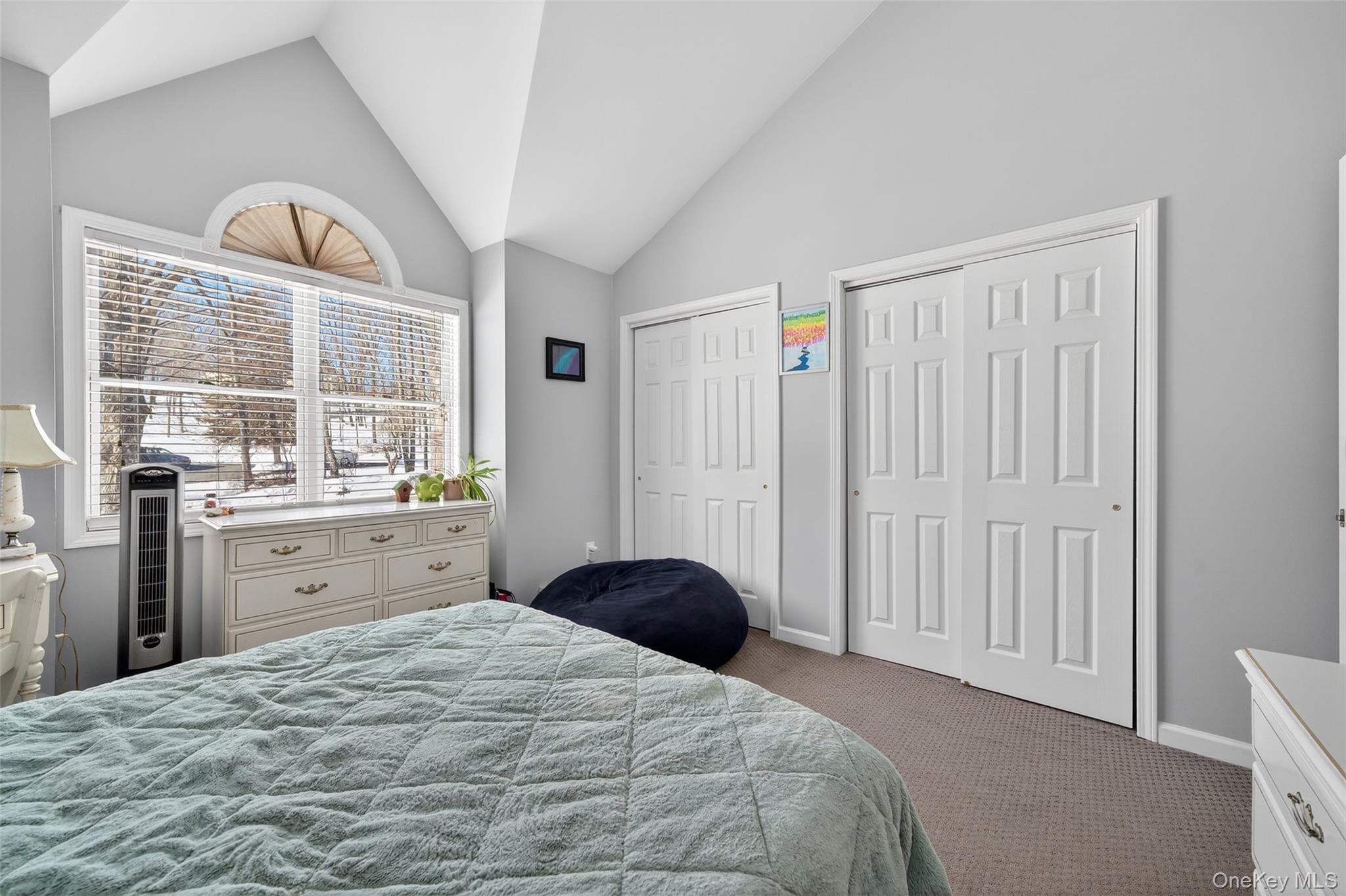 34 Booth Road Chester, NY 10918 - Photo 26 of 42 Bedroom with multiple closets, vaulted ceiling, and carpet