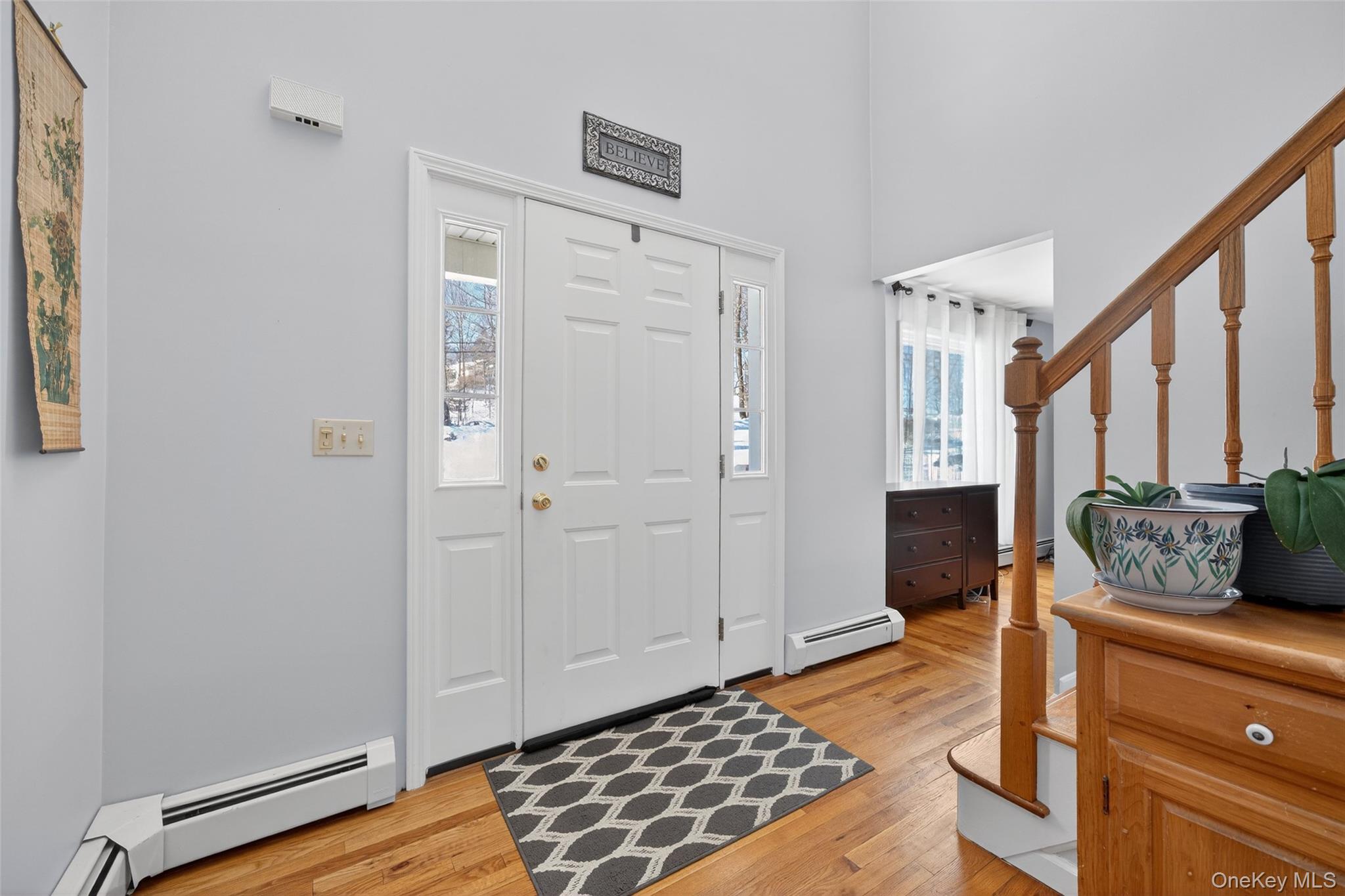 34 Booth Road Chester, NY 10918 - Photo 6 of 42 Entrance foyer with wood floors and a healthy amount of natural light, and a high ceiling