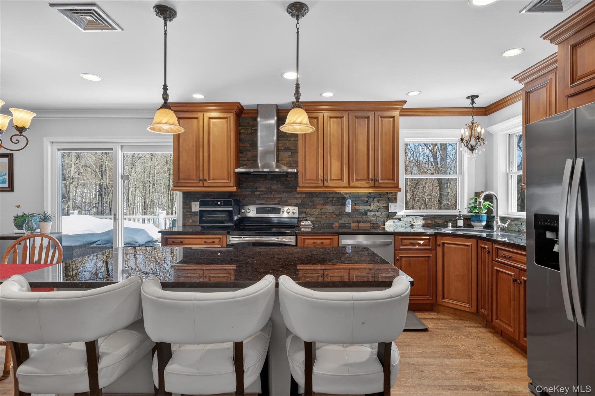34 Booth Road Chester, NY 10918 - Photo 9 of 42 Kitchen featuring wood finish cabinets, crown molding and stainless-steel appliances