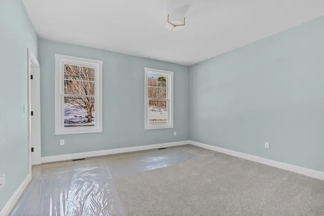 a view of room with window and hardwood floor