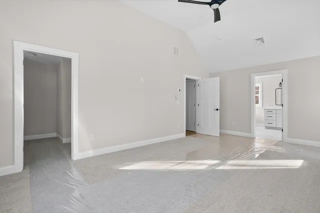 a bathroom with a double vanity sink mirror and bathtub
