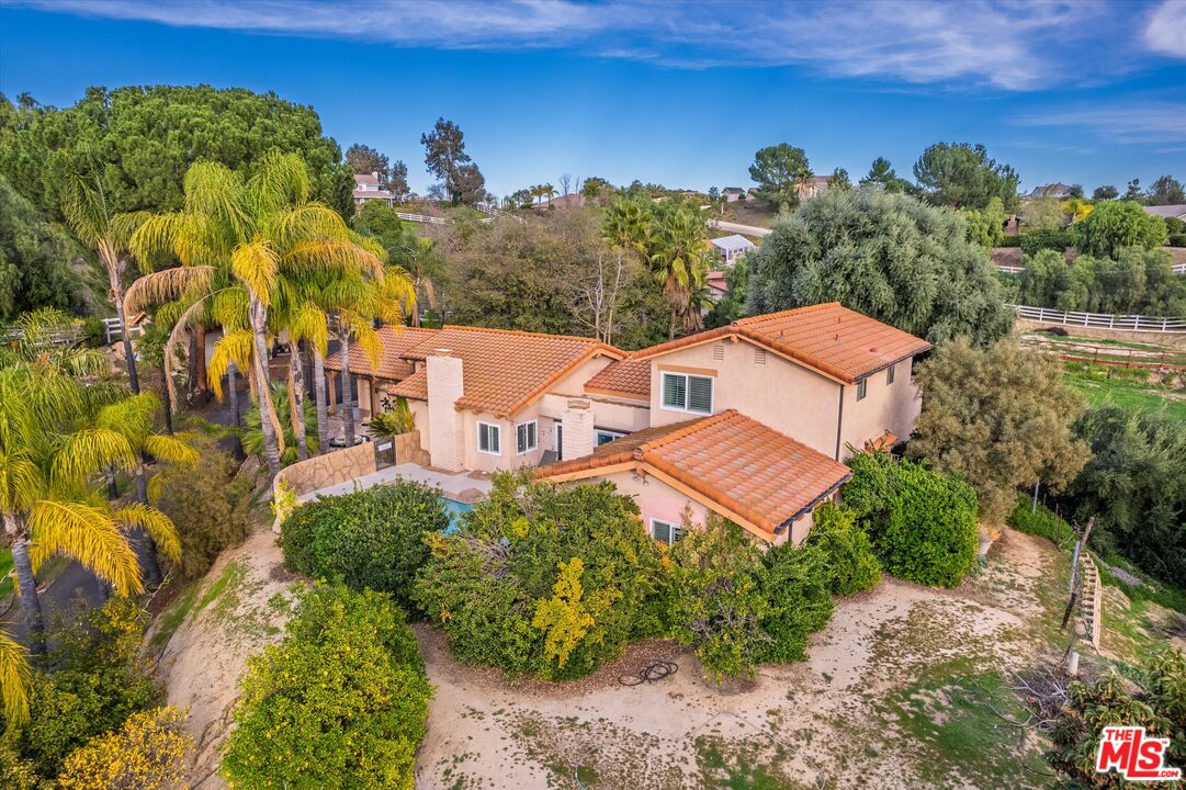 a aerial view of a house with a garden