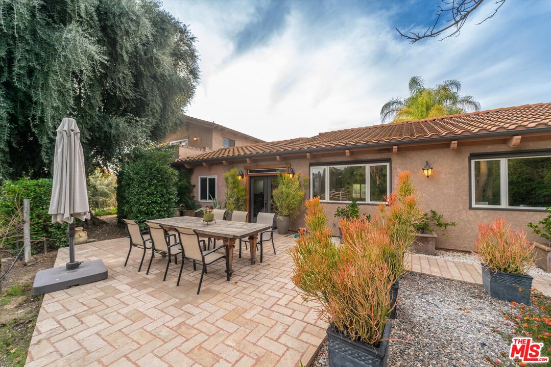 39700 Ave Arizona Temecula, CA 92591 - Photo 2 of 23 a view of a house with backyard sitting area and garden
