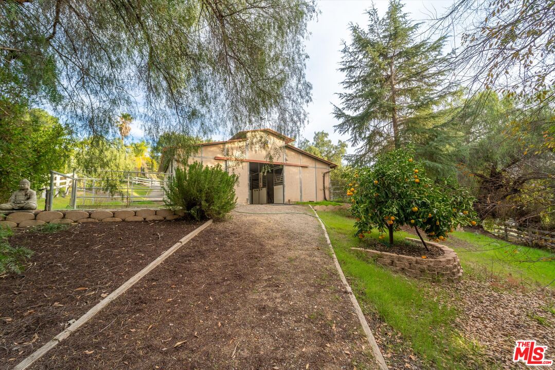 39700 Ave Arizona Temecula, CA 92591 - Photo 21 of 23 a front view of a house with a yard and tree s