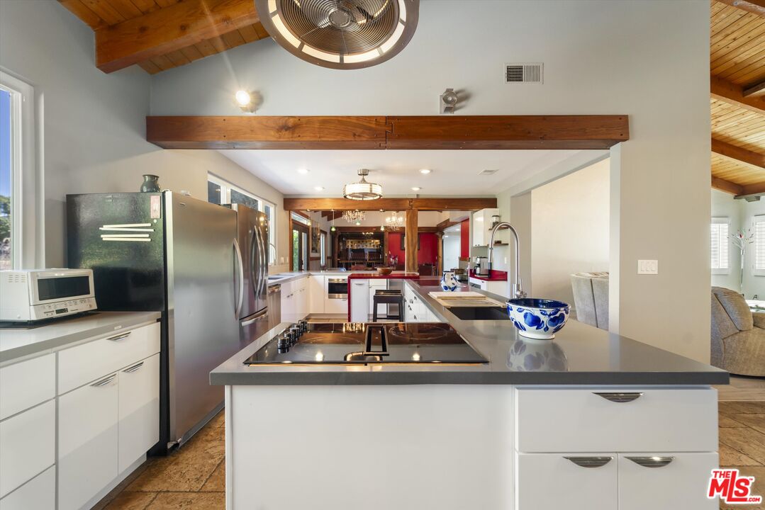 39700 Ave Arizona Temecula, CA 92591 - Photo 5 of 23 a kitchen with stainless steel appliances granite countertop a sink and a refrigerator