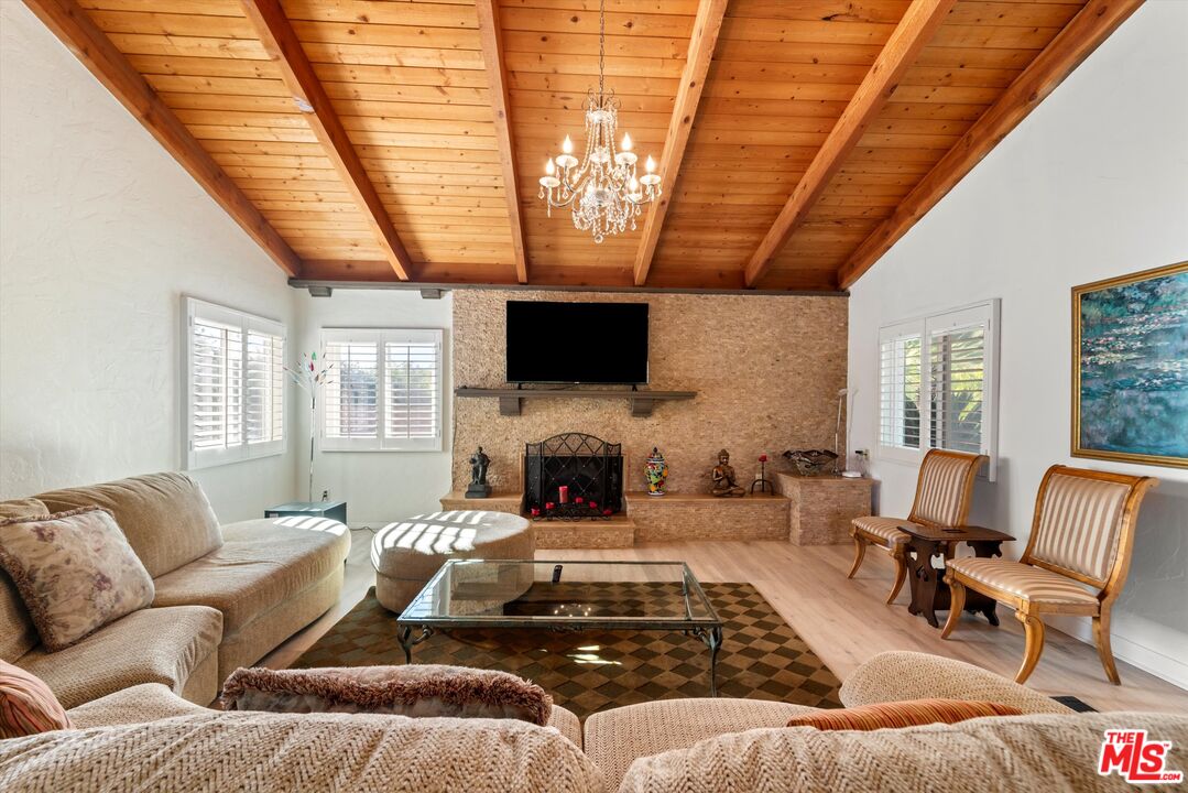 39700 Ave Arizona Temecula, CA 92591 - Photo 6 of 23 a living room with furniture a fireplace and a flat screen tv