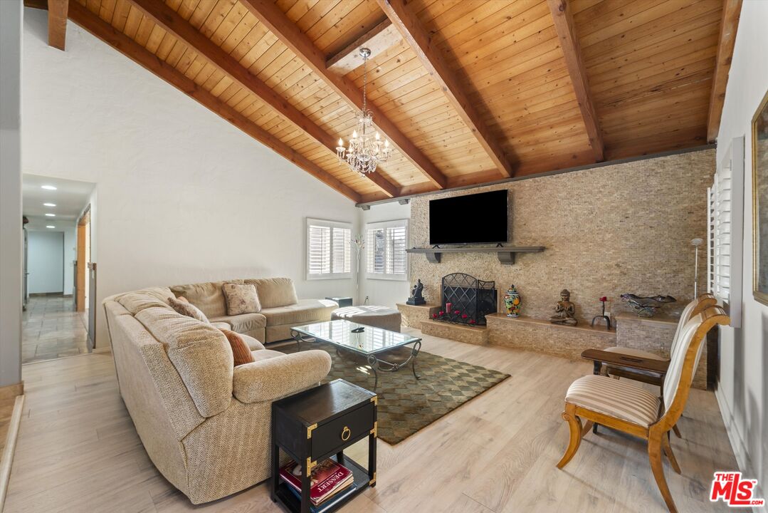 39700 Ave Arizona Temecula, CA 92591 - Photo 7 of 23 a living room with furniture a flat screen tv and a fireplace