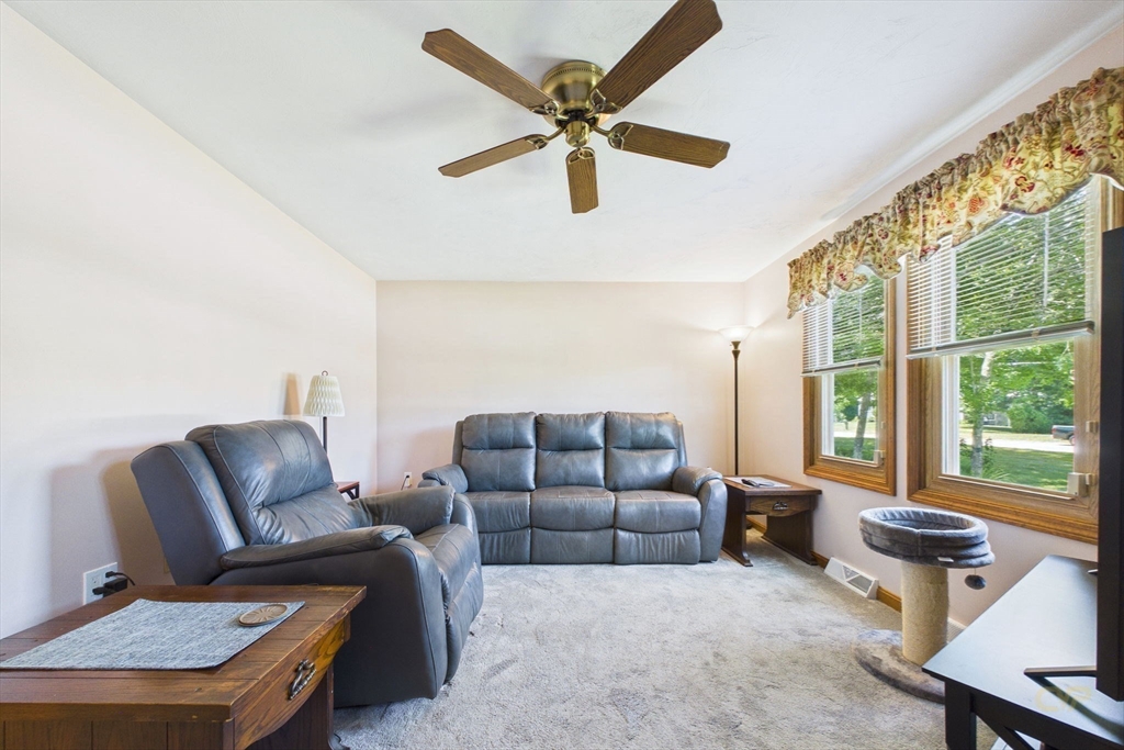 8 Cotuit Road Taunton, MA 02718 - Photo 13 of 24 a living room with furniture and a large window with wooden floor