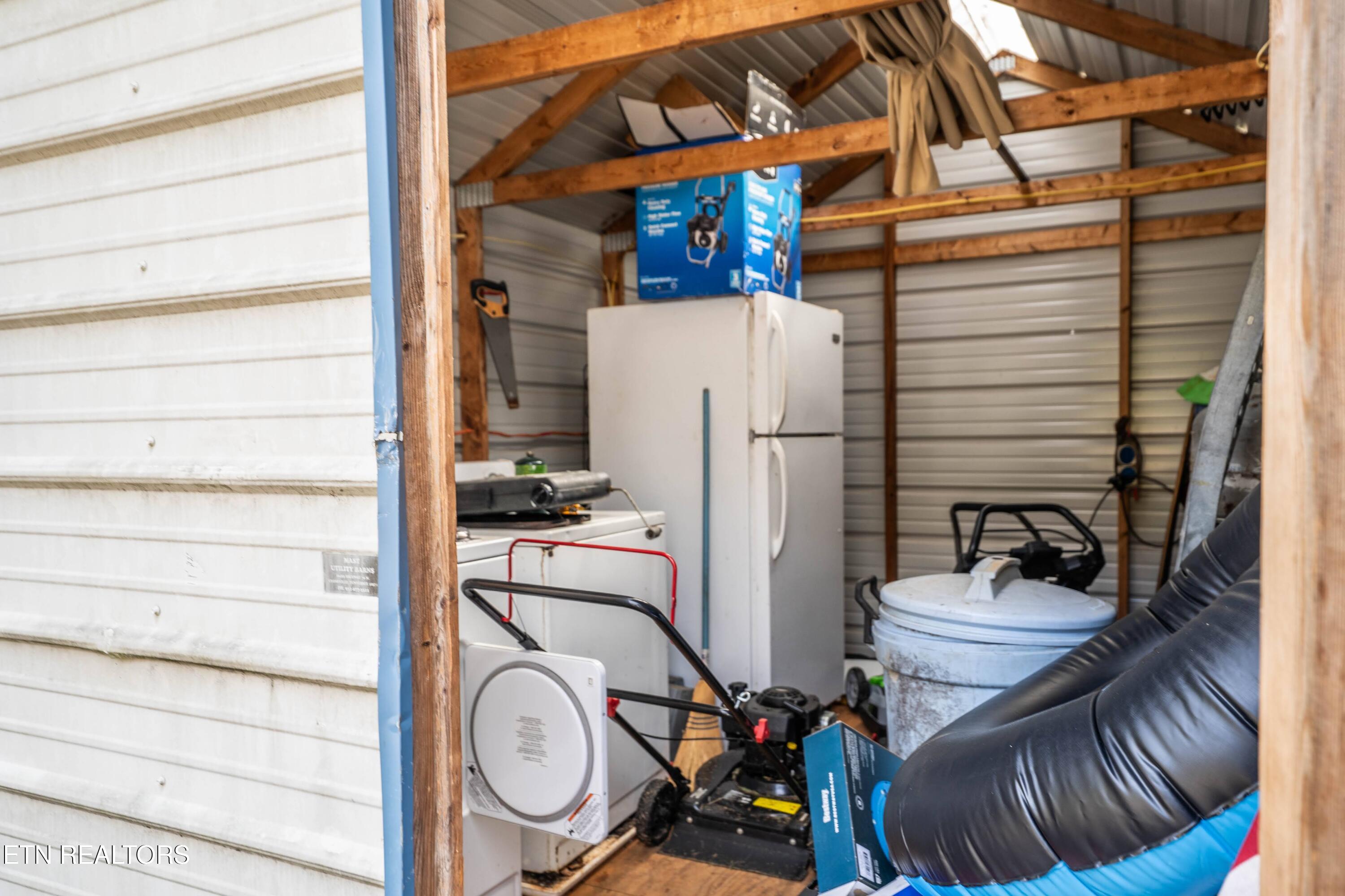 32 Reeves Place Monterey, TN 38574 - Photo 10 of 27 Inside Shed with Frig washer and dryer