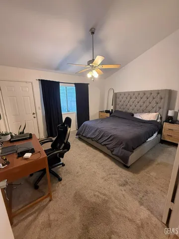 a bedroom with a bed and a piano