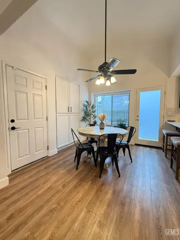 a view of a dining room with furniture and wooden floor