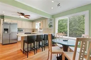 a view of a dining room with furniture window and outside view