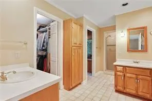 a bathroom with a sink vanity and a mirror