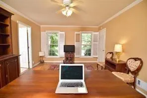 a living room with furniture a large window and a chandelier
