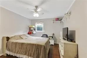 a bed room with a bed and a television