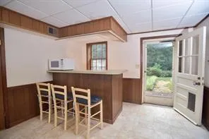 a dining room with a table and chairs