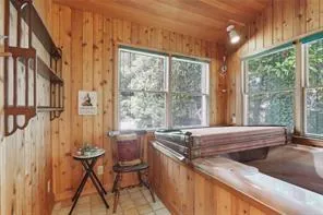 a view of a kitchen with furniture and windows