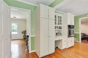 a view of kitchen with furniture and wooden floor