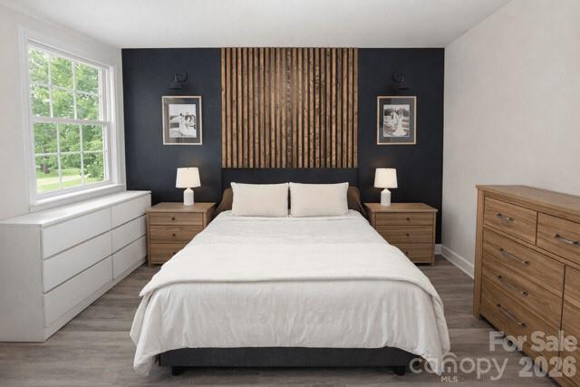 636 Willis Road Dallas, NC 28034 - Photo 13 of 18 a bedroom with a bed and a window