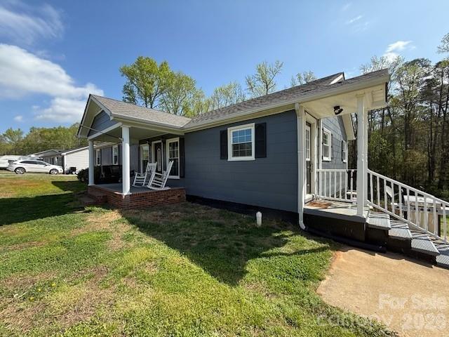 636 Willis Road Dallas, NC 28034 - Photo 3 of 18 a view of a house with backyard and porch